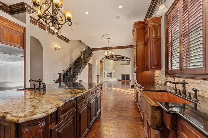 Kitchen looking toward casual dining space and living room