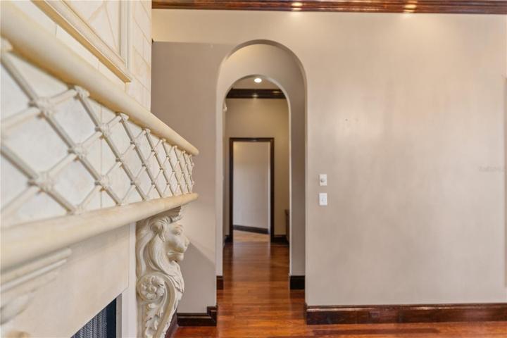 Formal dining room looking into the hallway with built-in desk and leading to laundry room