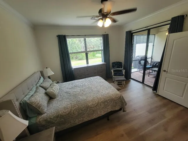 Main Suite view of preserve and patio/lanai - new laminate flooring