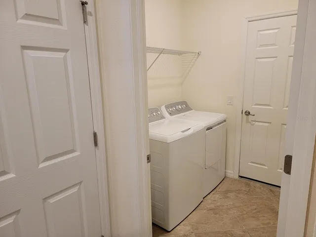 Laundry room with door to 2 car garage