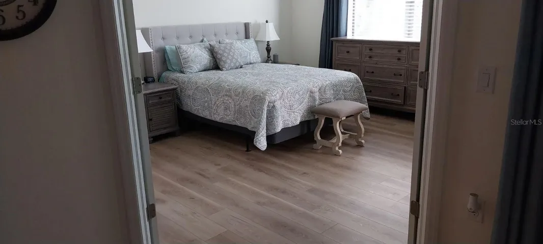 Double door entrance to Main Suite with new laminate flooring