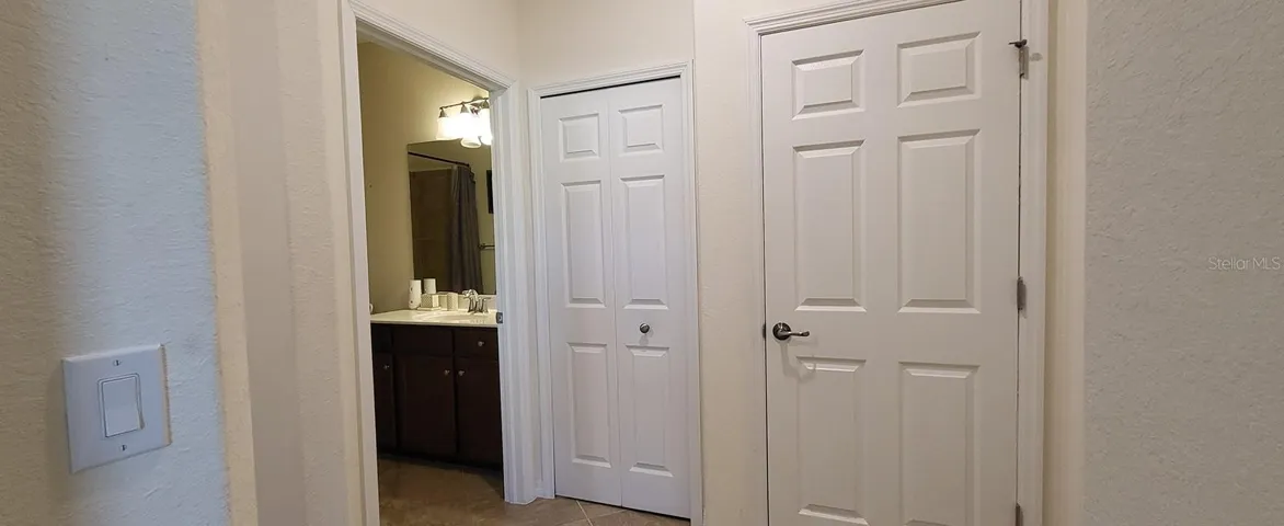 Hallway with linen and A/C closets