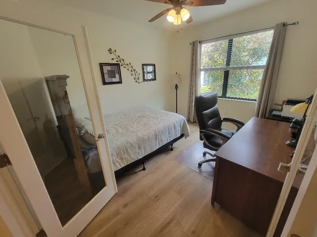 Den with glass double doors (no closet), roomy enough for full bed and desk or a media room