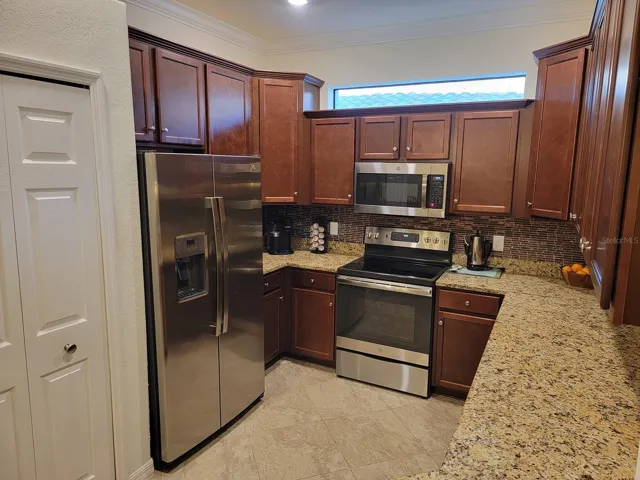 Kitchen with granite counters and extra large cabinets