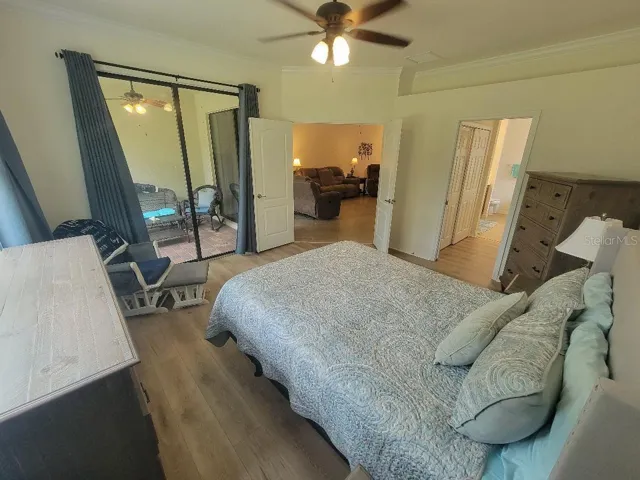 Main Suite with sliding glass doors to patio/lanai