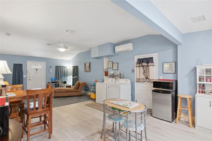 open living area with access to the garage