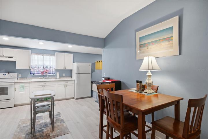 large dining and kitchen area open to the living area