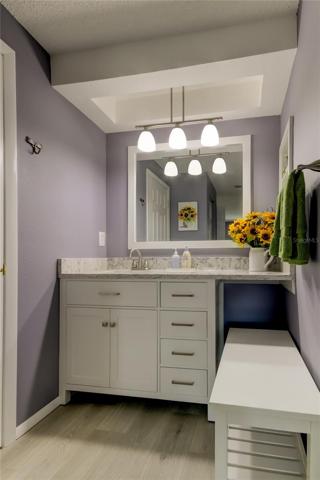 En Suite Bathrm (5' x 9.4') Dedicated Vanity.. Gorgeous Quartz Counter.. Dressing Bench for Convenience.. Walk In & Linen Closets!