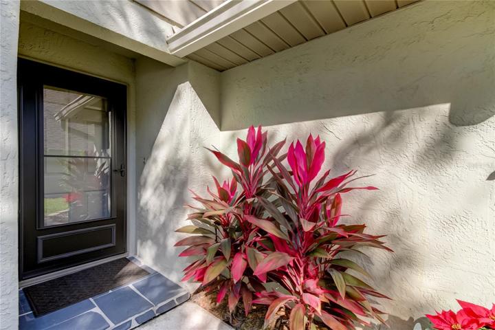 Inviting Front Porch with Beautifully Landscaped Surroundings..