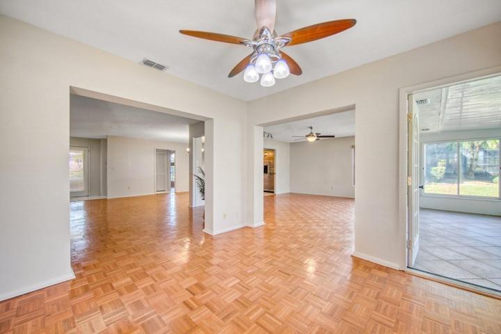 Office/Den openings to living room, family room & Florida room addition~
