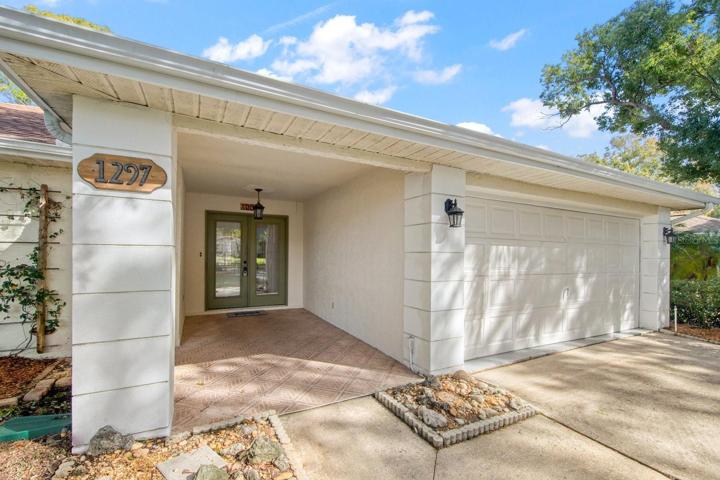Gracious covered entry - room for a welcome bench or chairs~