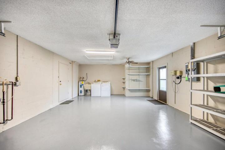 Freshly painted garage with laundry station, utility sink & attic access~