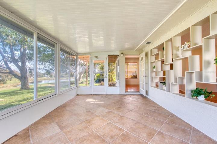 Pretty views from the Florida room with door to rear patios~