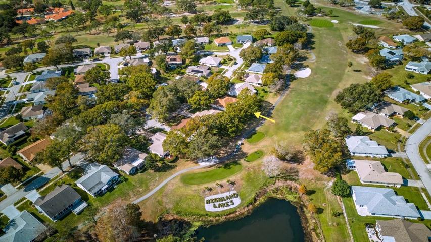 Home backs up to golf course near the iconic Highland Lakes landscape sign~