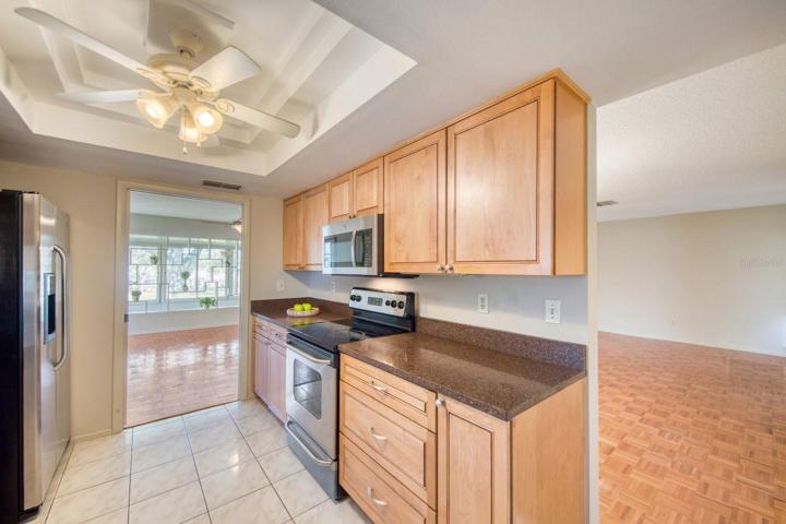 Stainless steel appliances & wood cabinets~