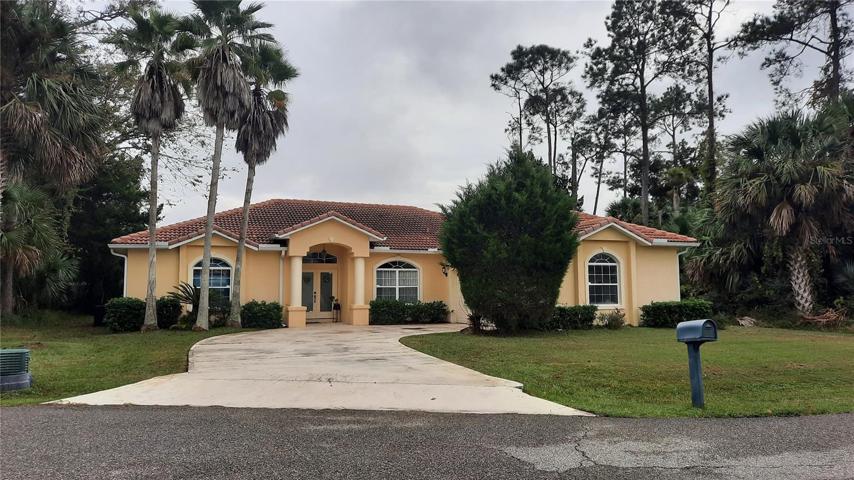 Front of the house with circular driveway