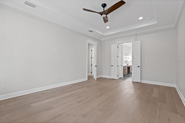 First floor primary bedroom similar completed home