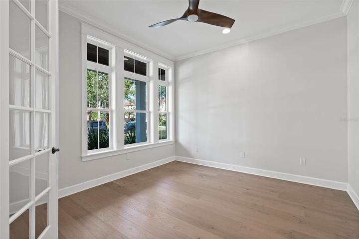 den/study off the foyer in similar completed home