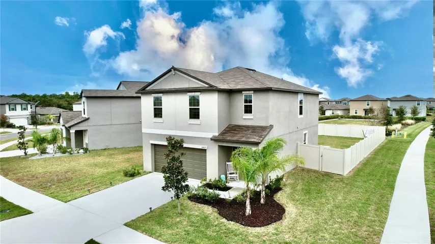 Oversized corner lot with ample room and neighbors on just one side of the property .