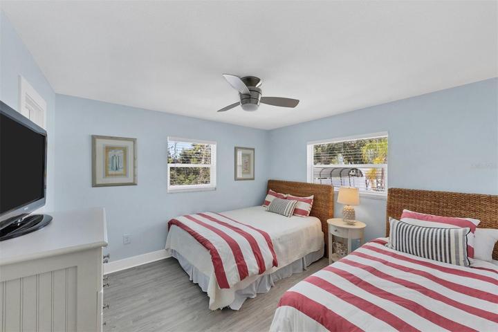 Second Bedroom maximizes sleeping for guests with a queen bed and additional twin bed. There's also a large walk-in closet for added storage.