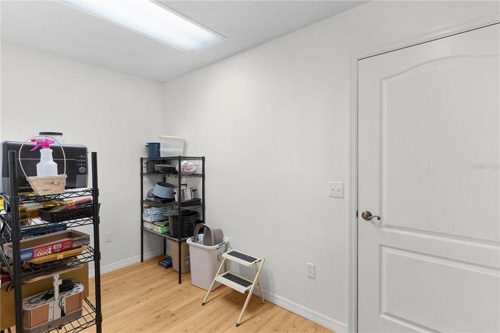 LAUNDRY ROOM CONVERTED TO STORAGE - WOULD MAKE A GREAT OFFICE AREA!