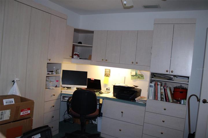 3rd bedroom with built in desk and murphy bed.