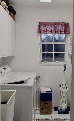 laundry room with extra storage