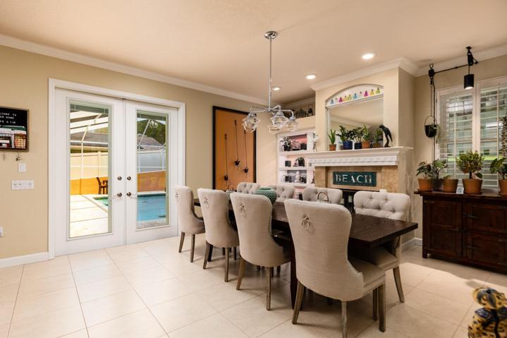 Dining Room with fireplace and access to Pool Deck