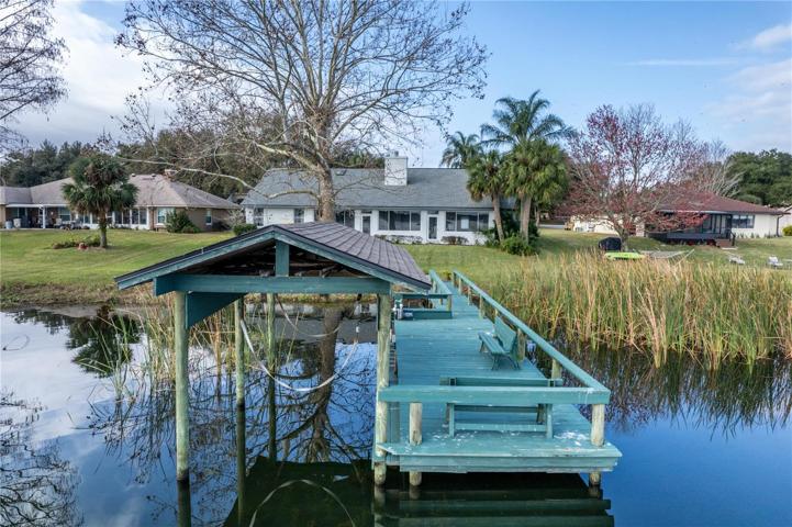 Boat dock with covered lift