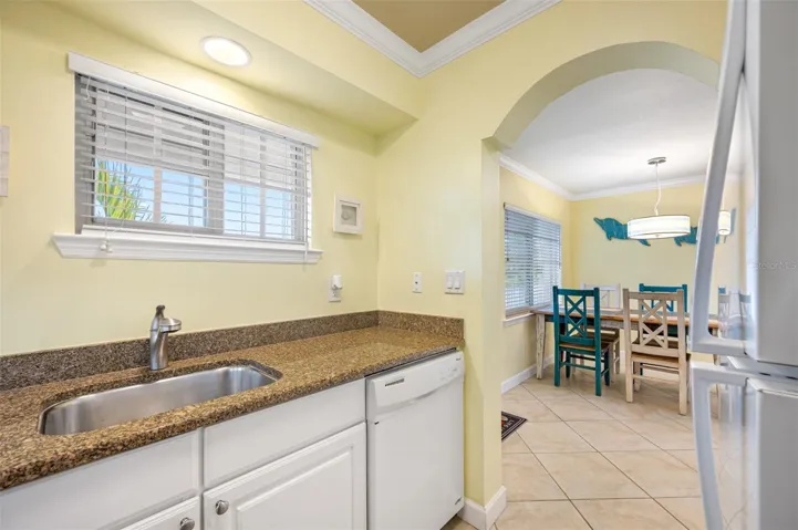 Charming arched doorway and crown molding