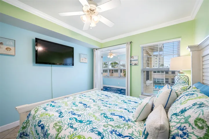 Bedroom with Flatscreen TV leads to the Sunroom