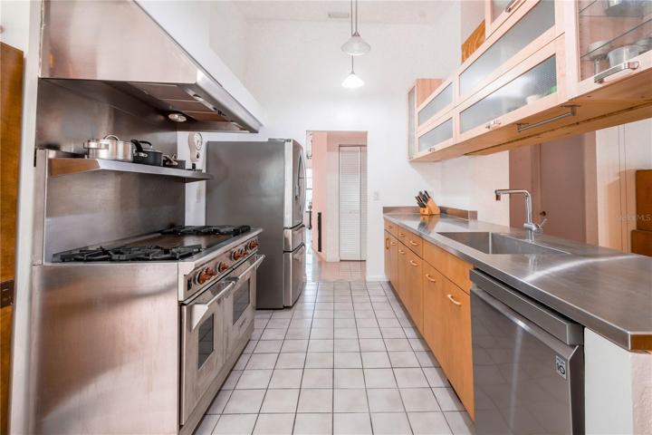 The kitchen features stainless steel countertop.