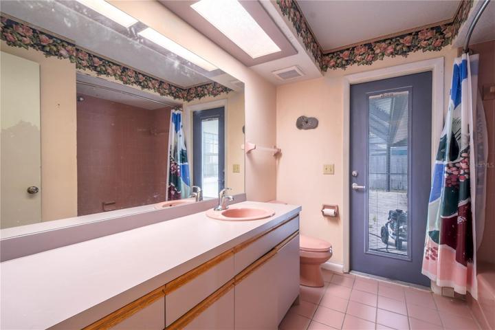 Bathroom 2 has a door to the pool and lanai.