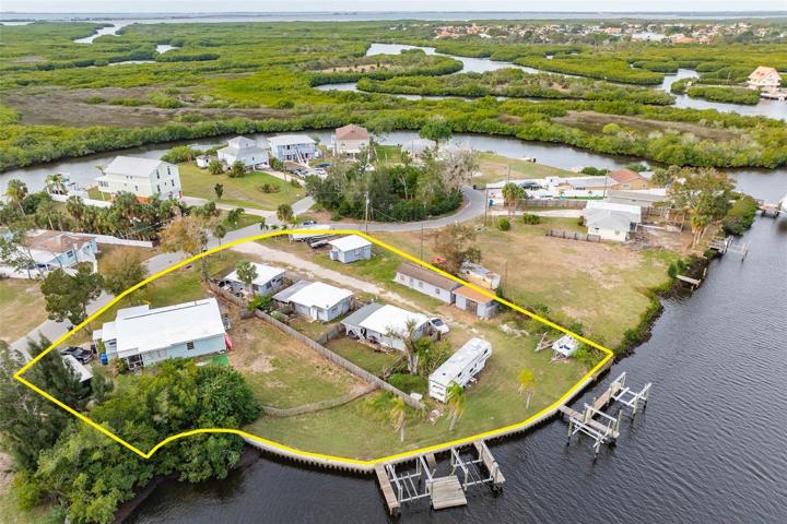 2 Lots being sold together, Deep Water, 240 Water Frontage, 4 Docks with Remote Controlled Lifts, 5 Dwellings, 2 additional buildings