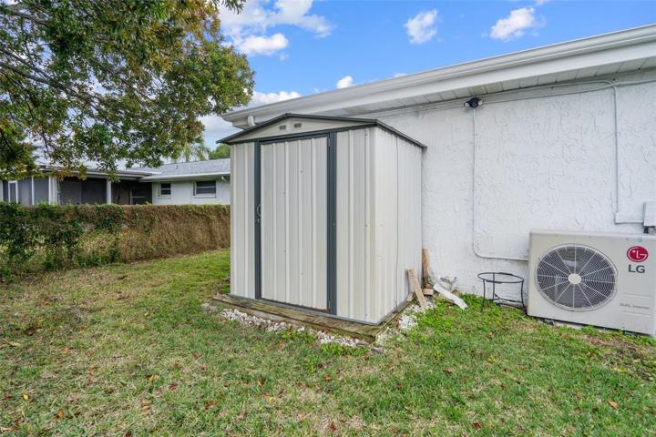 Rear of Home with Shed and Fenced Yard