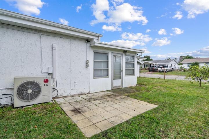 Rear of Home with Open Patio and Fenced Yard