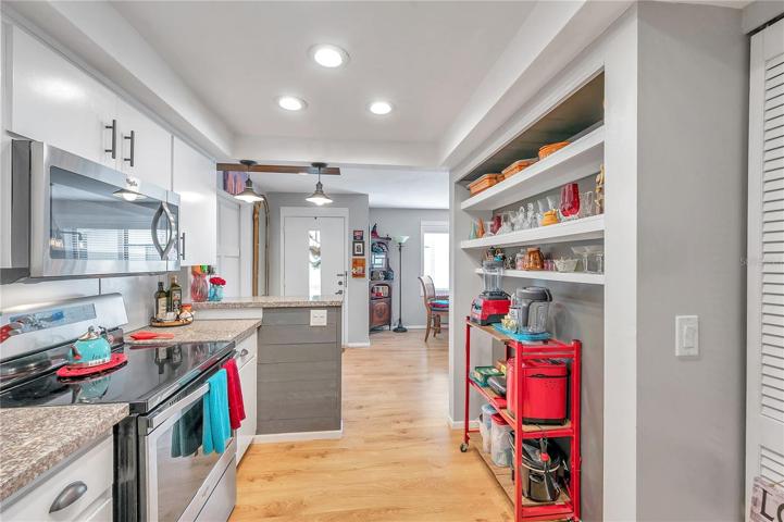 Kitchen overlooks the entrance and dining room