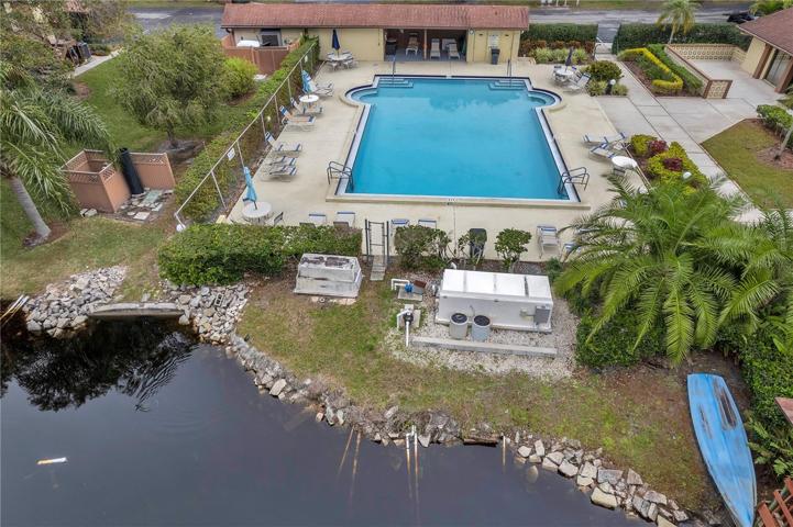 Community pool is adjacent to the lake
