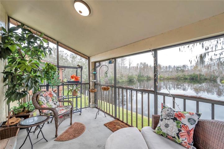 rear balcony overlooks the community lake