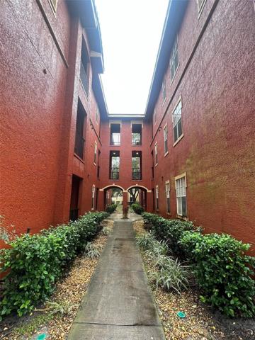 Walkway to security keypad to gain access to the inside courtyard