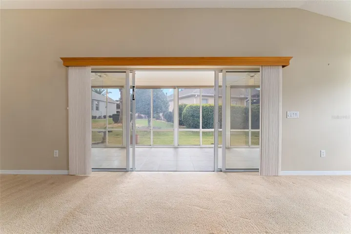 SLIDING GLASS DOORS leading to ENCLOSED LANAI