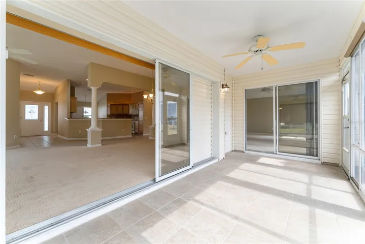 ENCLOSED LANAI - SLIDING GLASS DOOR access to Primary Suite (R Back)