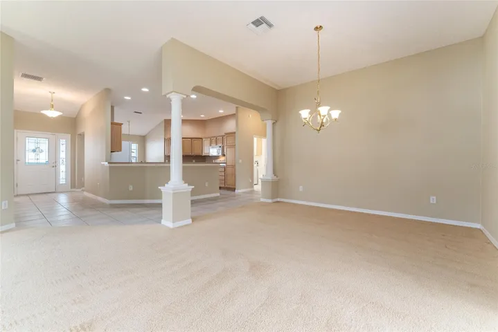 View of FOYER, KITCHEN (back) & DINING ROOM (front)