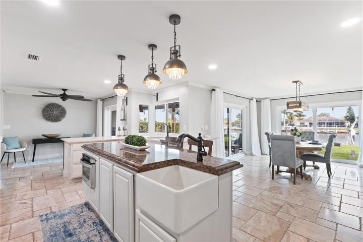kitchen features 2 large farm sinks, one on the center island and one near the kitchen window