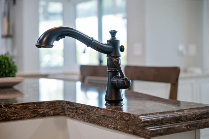 oil rubbed bronze finishes give nice contrast to the light cupboard colors