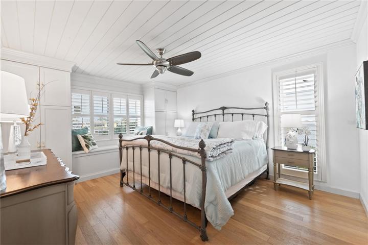 Primary master bedroom 1 with custom built in closets, views of the water , king sized antique bed and furniture so tranquil and serene