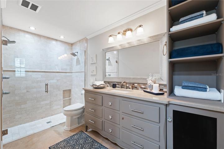 huge walk in shower and custom bathroom vanity, decorated in neutral tones