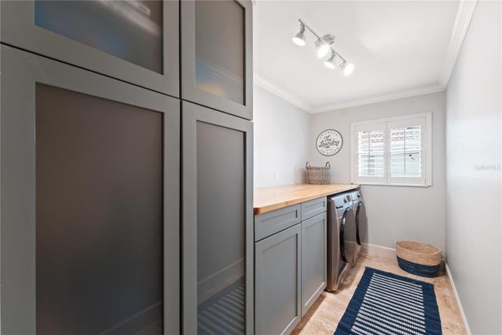 huge laundry room off the kitchen with great counter top space for folding clothes