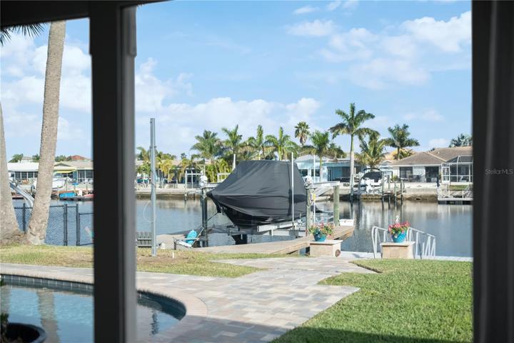 20,000 boat lift with lots of walk around deck space with a firepit