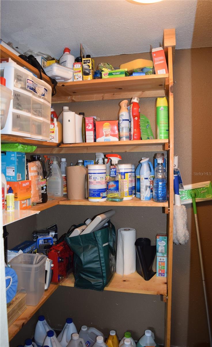 Cleaning/storage room in utility/laundry room